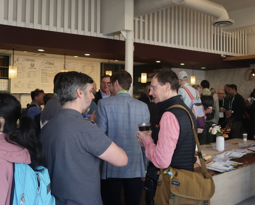 Attendees grabbing coffee and hanging at an Energy Central event